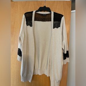 Cream cardigan with black lace.